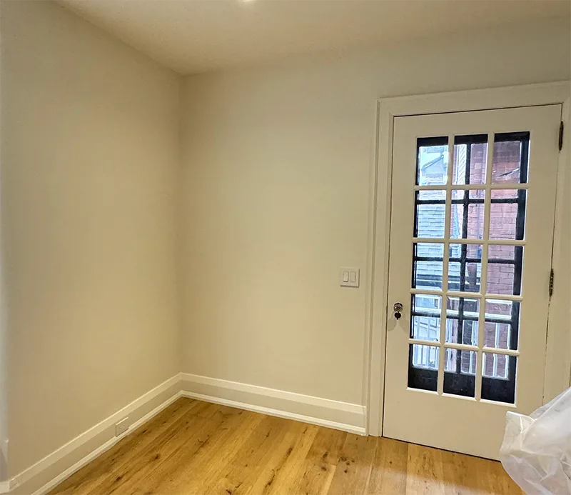 Experienced interior painter working on wall painting for living room in Toronto